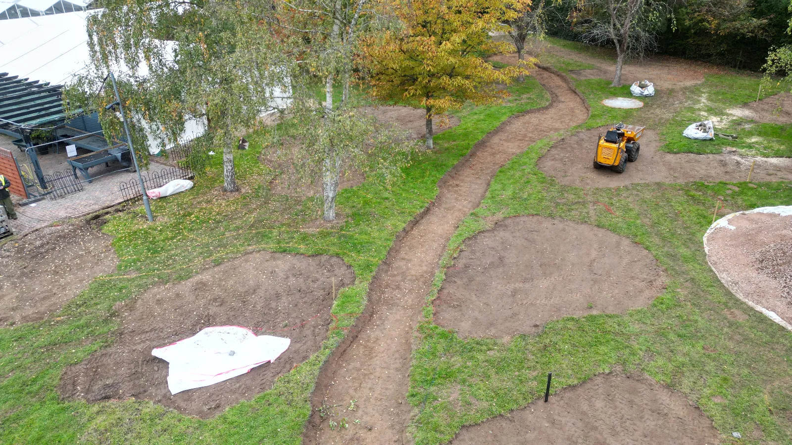 An aerial view of a garden with a tractor.