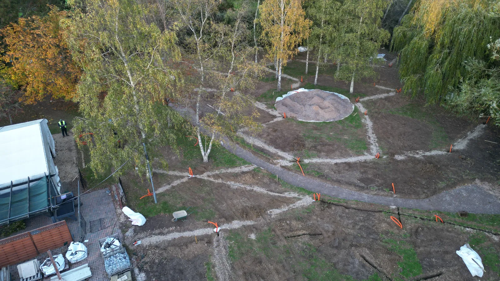 An aerial view of a park in the middle of a forest.