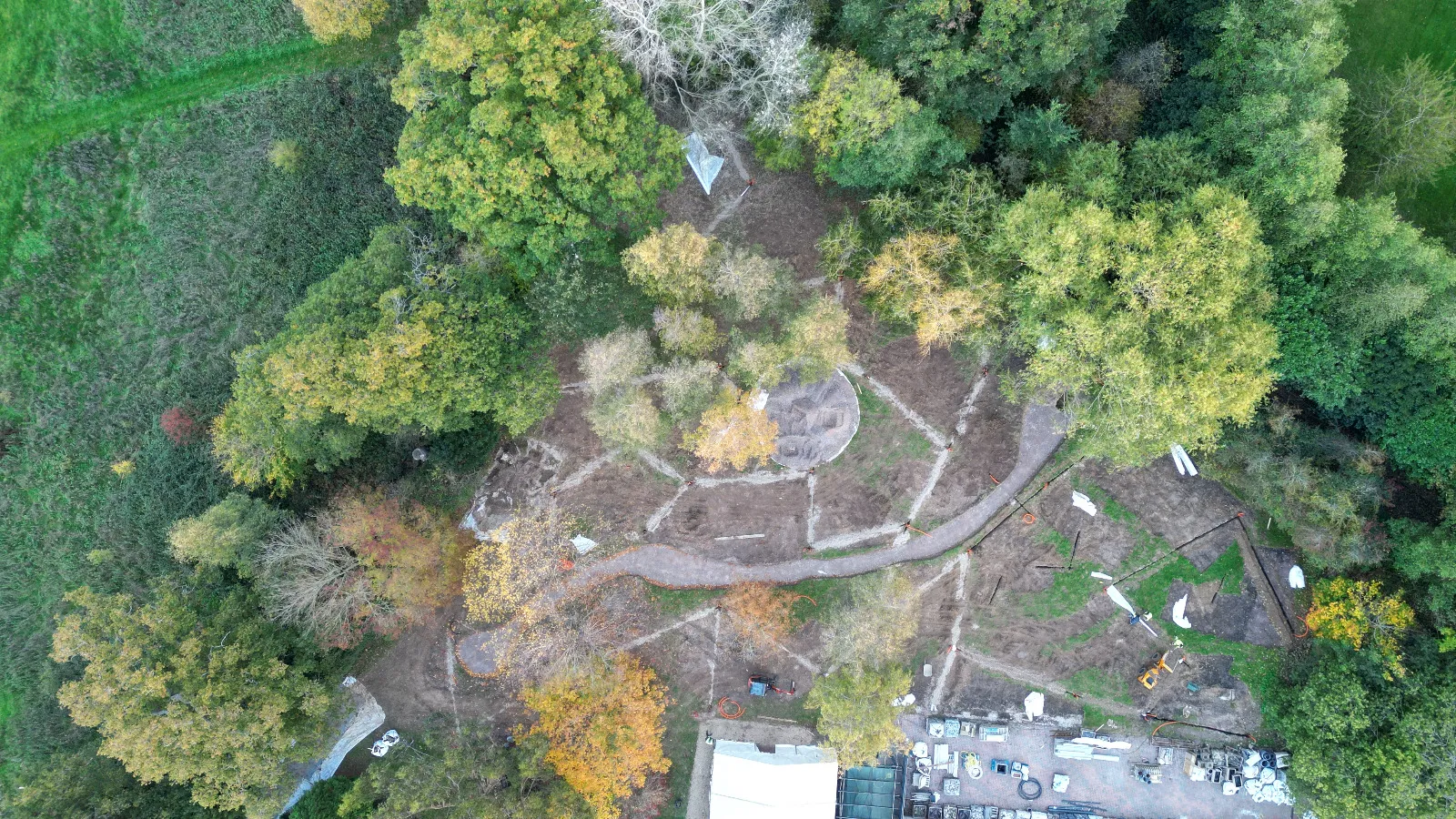 An aerial view of a park in the middle of a forest.