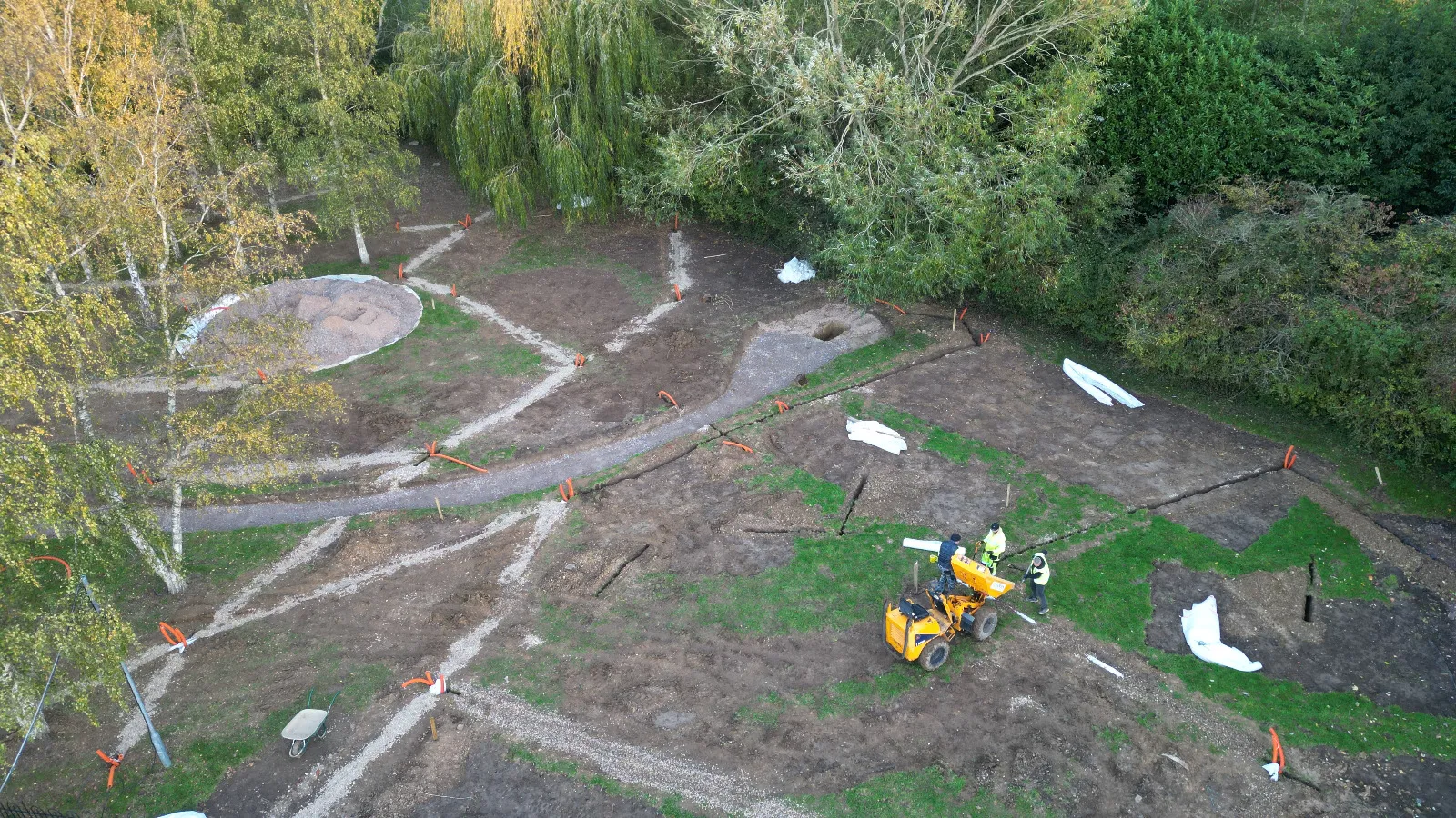 An aerial view of a construction site in the woods.