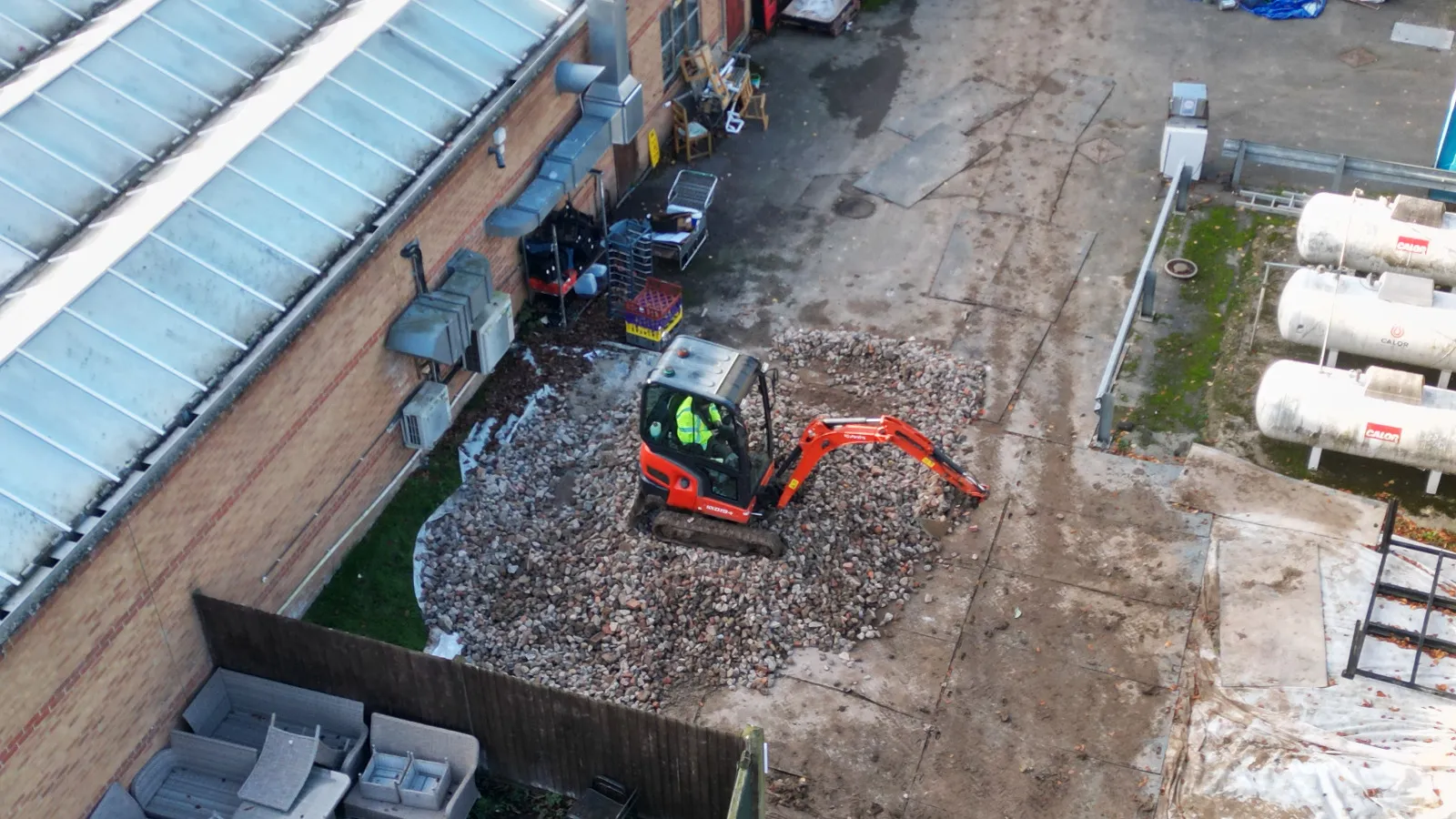 An aerial view of a construction site with a bulldozer.